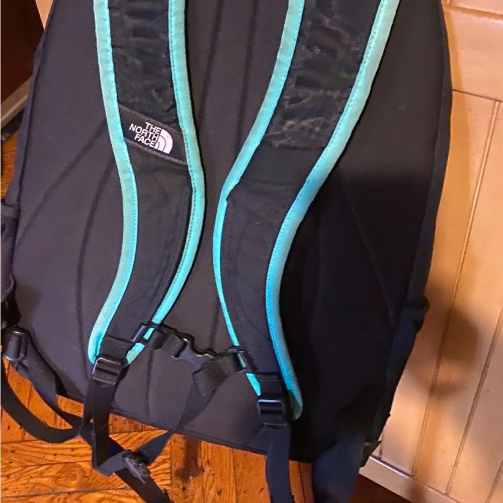 The North Face Jester Black Backpack with Teal Straps